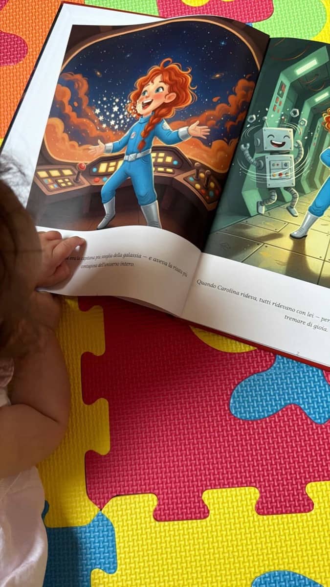 Baby Carolina's hands on her open personalized LegendCraft book